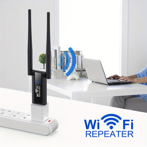 Black dual-antenna Wi-Fi repeater powered by a USB wall adapter beside a home workspace.