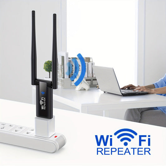 Black dual-antenna Wi-Fi repeater powered by a USB wall adapter beside a home workspace.